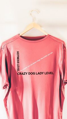 a pink shirt that says crazy dog lady level