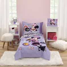 a child's bedroom with pink walls and mickey mouse bedding