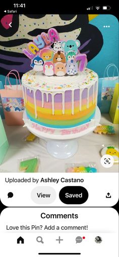 the cake is decorated with colorful icing and has decorations on it, along with other items