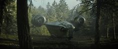 an abandoned airplane in the middle of a forest