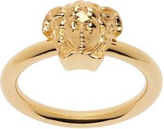 Band ring in gold tone. · Medusa hardware at face · Logo engraved at inner band Supplier color: Versace gold Medusa Ring, Versace Ring, Versace Gold, Face Logo, Womens Jewelry Rings, Band Ring, Band Rings, Apparel Accessories, Gold Metal