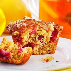 a muffin cut in half sitting on top of a white plate