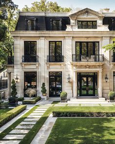 a large white house with lots of windows