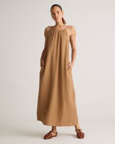 Our 100% Organic Cotton Gauze Sleeveless Maxi Dress is perfect for hot summer days, beach vacations, or evening strolls. With its elegant maxi length and high neck design, this dress ensures you'll look polished and put-together for any occasion. Made of breezy, lightweight organic cotton gauze, this dress will keep you cool all summer long!  | Quince | Women's Gauze Sleeveless Maxi Dress in Toasted Coconut, Size XL, Organic Cotton Look Polished, High Neck Designs, Silk Cami, Beach Vacations, Quarter Zip Sweater, Scarf Gift, Toasted Coconut, Organic Fabrics, Sleeveless Maxi Dress