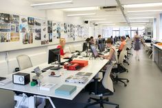 an office filled with people working on computers