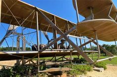 an old airplane is sitting on the ground