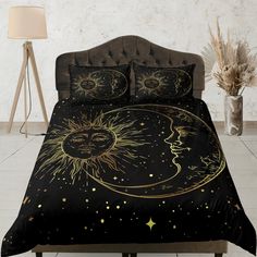 the sun and moon are depicted on this black comforter bed set with matching pillows