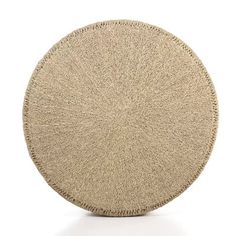 a beige round rug on a white background