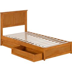 a wooden bed with drawers underneath it