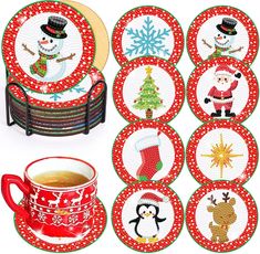 christmas coasters with snowman, reindeer, and penguin on them next to a cup of coffee