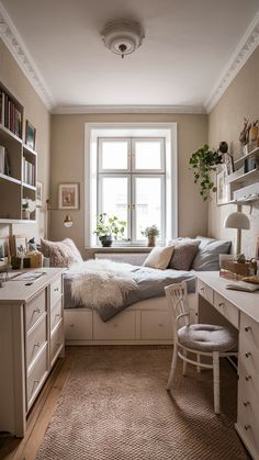 a bedroom with a bed, desk and window