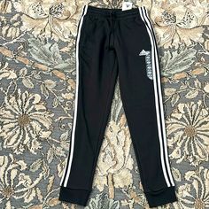 Black Adidas Sweatpants Black Adidas Sweatpants, White Tracksuit, Snap Pants, Logo Pants, Track Pants Women, Adidas Windbreaker, Adidas Sweatpants, Adidas Track Pants, Black Sweatpants