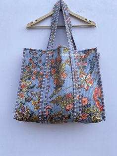 cotton print Bag The Indian Hand Block Printed Cotton Quilted Women's Handbags from Rajasthan India. This Handbag is completely Indian Printed on good quality cotton. Cotton quilted Jhola Bag made by Indian Artisans, this cotton quilted shopping bag is totally unique and multi purpose. Use this for your grocery or as a travel bag. Perfect to suit all. Item :- Cotton Handbag Material: Quilted Cotton Fabric Color - rainbow Pattern : Block Print Style: Tote Bag, Handle Bag, Shoulder Bag Size in Inch:- Height-18" inch Width- 19" inch Handle-13" inch Product Work: Printed & quilted Stitched Usage : Cosmetic, Make-up, Travel, Toiletries, Medicine, Accessories, Shopping and much more. Perfect for Beach Visits/ Quick Grocery runs/ Carrying Kids items/ Artist Paint book and Paints /Extra Bag Washab Cotton Handbag, Quilted Tote Bags, Indian Prints, Quilted Totes, Kids Items, Printed Quilt, Rainbow Pattern, Fabric Bag, Printed Bags