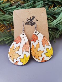 These are hand painted and wood burned teardrop earrings with a fall leaf design. They are 2 inches long and 1.5 inches wide. The hooks are stainless steel. Hand Painted Earrings Wood, Mdf Earrings, Barnwood Ideas, Crafting Business, Autumn Earrings, Fall Bead, Crafting Jewelry, Wood Burning Crafts, Hand Painted Earrings