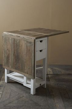 a wooden table with two drawers on one side and an open drawer on the other