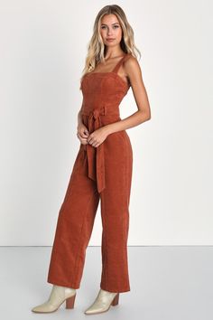 We don't know about you, but we're totally falling for the vibes of the Lulus Cutie Season Rust Orange Corduroy Wide-Leg Jumpsuit! Sturdy corduroy fabric shapes wide adjustable straps that support a princess-seamed bodice with belt loops and a removable sash belt. Banded waist tops wide-leg pants with bonus front-diagonal pockets, ending at ankle-length hems. Zipper/clasp at back. Fit: This garment fits true to size. Length: Ankle length. Size medium measures 9" from adjustable straps to hem. In Orange Jumpsuit Outfit, Burnt Orange Outfit, Fall Jumpsuit Outfit, Jumpsuit Outfit Fall, Airport Attire, Formal Romper, Corduroy Jumpsuit, Fall Wedding Outfits, Grad Outfits