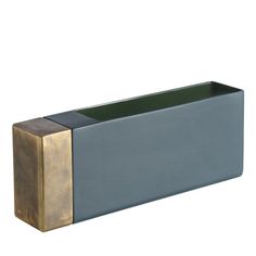 a gold and blue planter is shown against a white background, with the top part of the planter partially visible