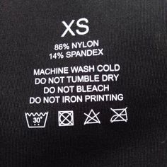 the back of a black t - shirt with white writing on it that says xs