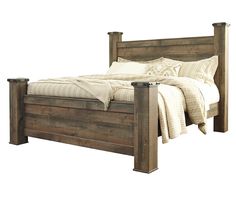 a bed with wooden headboard and foot board