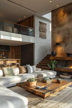 a living room filled with furniture and a fire place in the middle of it's wall