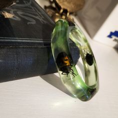 Amazing And Super Collectible 1960's Lucite Bangle Bracelet With Real Iridescent Beetles. This Piece Is So Special And So So Cool!! This Is A Mid-Century Green Tinged Clear Lucite Bracelet With Iridescent Beetles In It. A Really Spectacular Piece In Excellent Condition, Most Of These That I've Seen Do Not Have Beetles That Are This Pretty. Unmarked Condition: Great Vintage Condition With No Major Flaws Noted, Short Of Excellent, Shows Typical Signs Of Wear Which Can Include Scratches, Scuffs, Discoloration Or Chips. Wear Noted Throughout. Sticker Residue On The Inside That Would Not Come Off With Gentle Attempts At Cleaning It. A Small Chip And A Few Scratches And Scuffs Noted. Review Lucite Bracelets, Detail Photos, Beetles, So Cool, Vintage Ladies, Vintage Jewelry