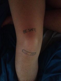 a person with a tattoo on their leg saying be safe