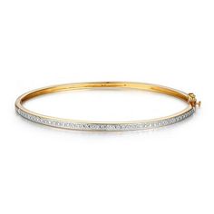 This sleek Forever Facets women's diamond accent bangle bracelet features a tailored linear design and makes a beautiful addition to any jewelry wardrobe. The bangle bracelet is plated in 18k yellow gold and rhodium for a true two-tone look. Shipped in a jewelry presentation box, ready for gift-giving, it makes a perfect present for birthdays, holidays, Mothers Day, Valentines Day, or for any special occasions. Size: one size.  Gender: female.  Age Group: adult. Classic Gold Bangle Bracelet With Pave Setting, Modern Channel Set Diamond Bracelet For Anniversary, Yellow Gold Channel Set Bracelets, Classic Channel Set Bangle As Gift, Channel Set White Gold Diamond Bangle Bracelet, Channel Set Diamond Bangle In White Gold, White Gold Channel Set Diamond Bangle Bracelet, White Gold Channel Set Diamond Bangle, Classic Bangle With Pave Setting For Anniversary