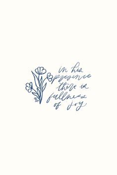 the words are written in blue ink on a white background with an image of flowers