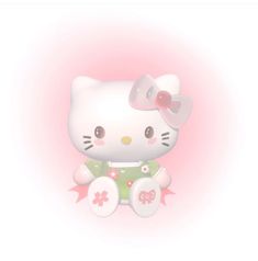 a hello kitty doll sitting on top of a pink background