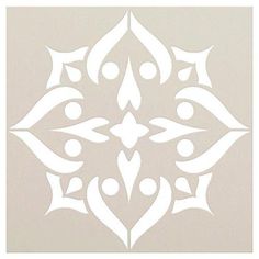 a white paper cutout with an ornate design