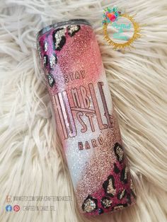 a pink and gold glitter tumbler with the words, stay wild on it's side