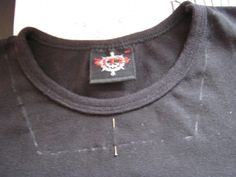 a close up of a t - shirt with a tag on the front and back