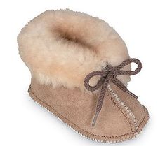 Baby love. Your little one will coo in delight when they wear these super-soft booties. A flexible leather sole supports growing feet, while the shearling lining keeps tiny tootsies warm. From Minnetonka. Love Your, Baby Love, Little One, Fashion Shoes, Shoe Boots, Boots, Leather, How To Wear