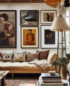 a living room filled with lots of furniture and pictures on the wall above it's coffee table