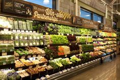 a grocery store filled with lots of fresh produce