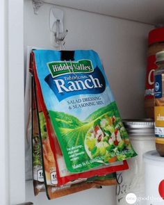 a bag of ranch seasoning sitting on top of a shelf next to other food