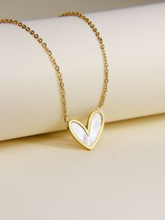 "* White Shell Heart Pendant Necklace * This necklace is made from stainless steel and features a heart-shaped pendant with Mother Of Pearl insert. This stunning piece of jewellery is perfect for any occasion. Wear it on its own or layer it up, either way this necklace is beautiful. The perfect gift for someone special to show them your never-ending love! ♥ Finish: Gold/Silver/Rose Gold Material: Stainless steel, Mother of Pearl Total length: 16\"+2\" Pendant Sizes: ~ 25mm x 25mm  Package: All jewelry comes in a beautiful box, ready for gifts. Category: Valentines Day Gift, Friendship Necklace, Wedding Gift, Everyday Necklace, Handmade Heart Necklace, Mother's Day Jewelry, Minimalist Daily Accessories, Bridesmaid Gift, Necklace For Sister, Trendy Necklace For Her, Gift For Valentines, Gift Cute Cheap Heart Necklace For Mother's Day, Affordable Heart-shaped Layered Necklace Gift, Cheap Heart Necklace For Mother's Day, Cheap Heart Pendant Necklaces For Mother's Day, Trendy Cheap Heart Necklace For Gift, Cheap Heart Pendant Necklace For Mother's Day, Trendy Cheap Heart Necklace For Mother's Day, Cheap Trendy Heart Necklace For Mother's Day, Affordable Cute Heart Necklace For Mother's Day