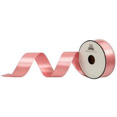 a roll of pink satin ribbon on a white background with the word love in it