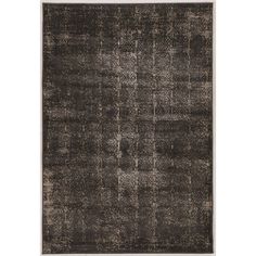 an area rug with black and grey squares