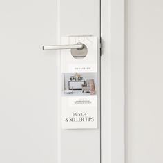 a door handle on a white door with a business card hanging from it's side