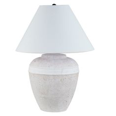 a white table lamp with a white shade on it