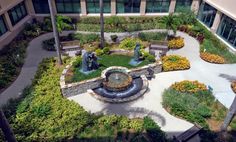 an aerial view of a courtyard and fountain