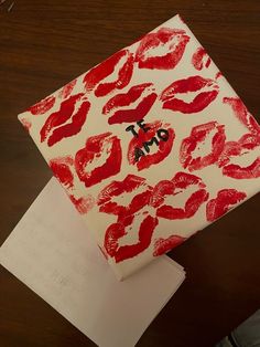 a piece of paper that has some red lipstick on it