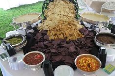 a table topped with lots of different types of food and condiments on top of it