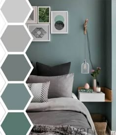 a bedroom with green walls and grey bedding, pictures on the wall above it