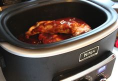 a slow cooker with some food inside of it