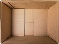 an open cardboard box sitting on top of a table