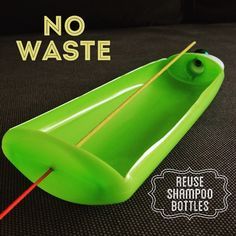 a green toy boat sitting on top of a black surface with the words no waste written above it