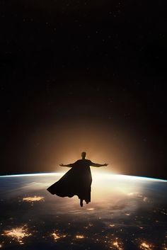 a man standing on top of the earth with his arms outstretched