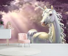 a room with a unicorn wall mural and pink chair in front of it, next to a white dresser